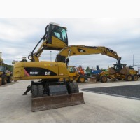 Грейферный перегружатель Caterpillar M318D