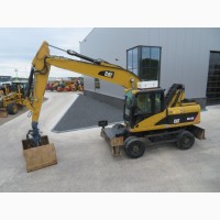 Грейферный перегружатель Caterpillar M318D